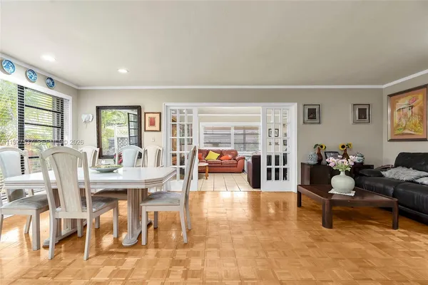a living room with fireplace furniture and a large window