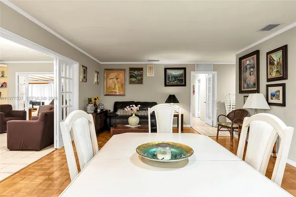 a living room with furniture a couch and wooden floor