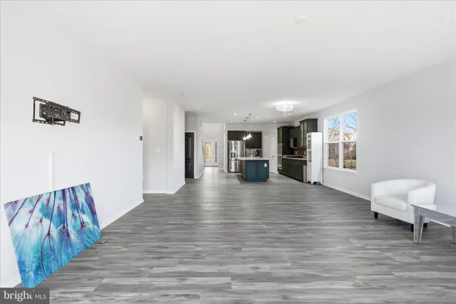 a view of kitchen with furniture and wooden floor
