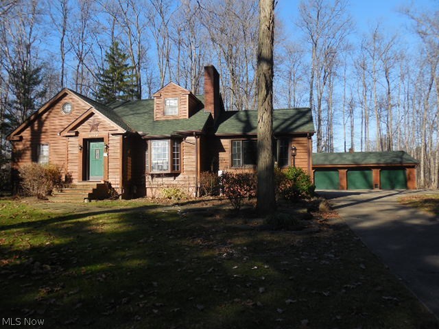 8644 Cedar Road Chesterland, OH 44026 - Photo 2 of 15 Wooded lot with mature trees. Great three car garage with a heater.