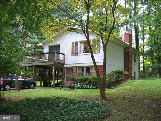12510 Harford Road Hydes, MD 21082 - Photo 1 of 7 a front view of a house with a garden