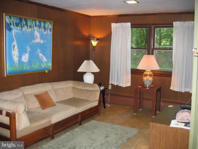 12510 Harford Road Hydes, MD 21082 - Photo 2 of 7 a living room with furniture and a large window