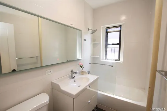 a bathroom with a sink toilet and tub