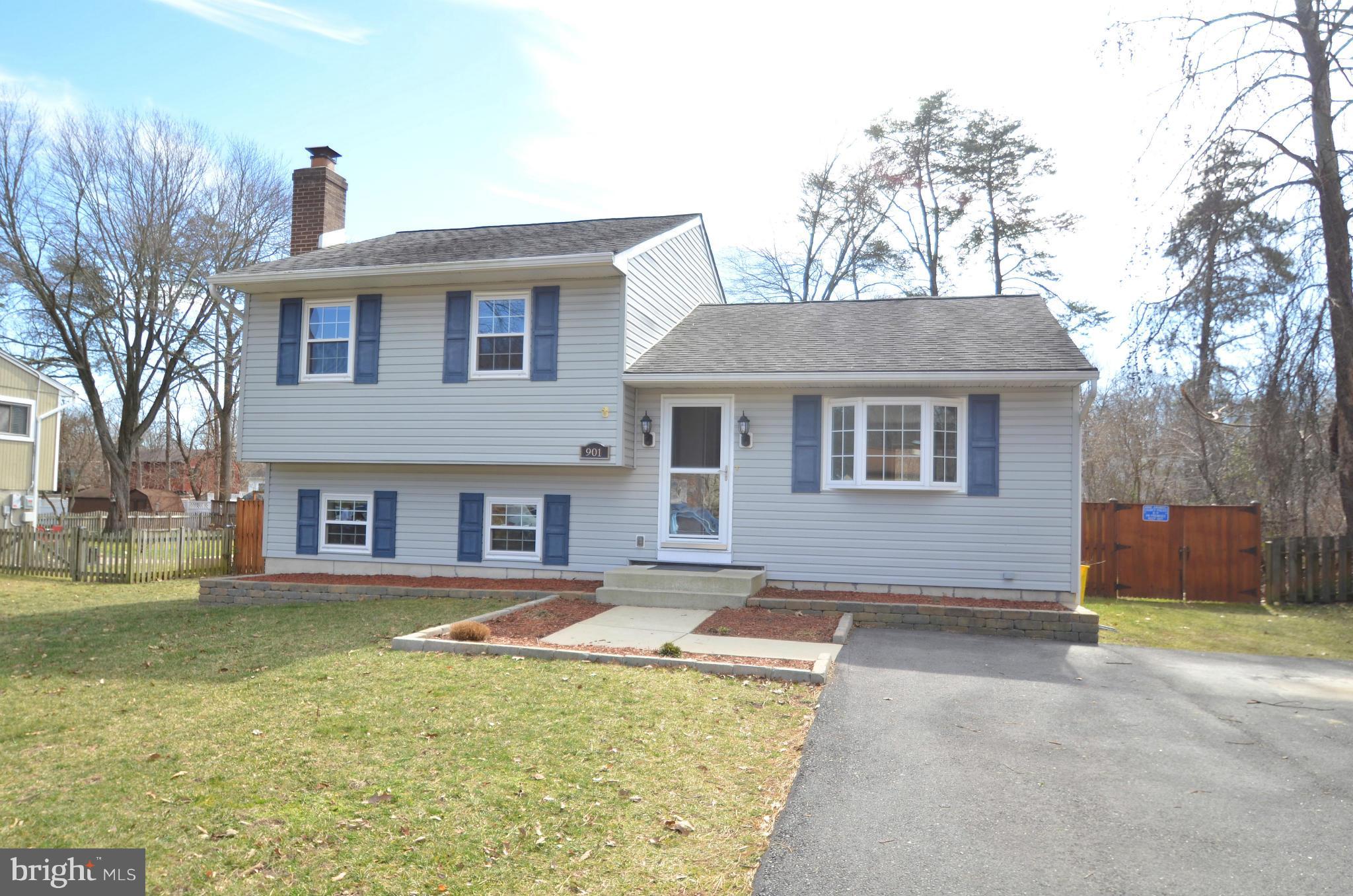901 Beech Tree Road Severn, MD 21144 - Photo 1 of 27 a front view of a house with a yard