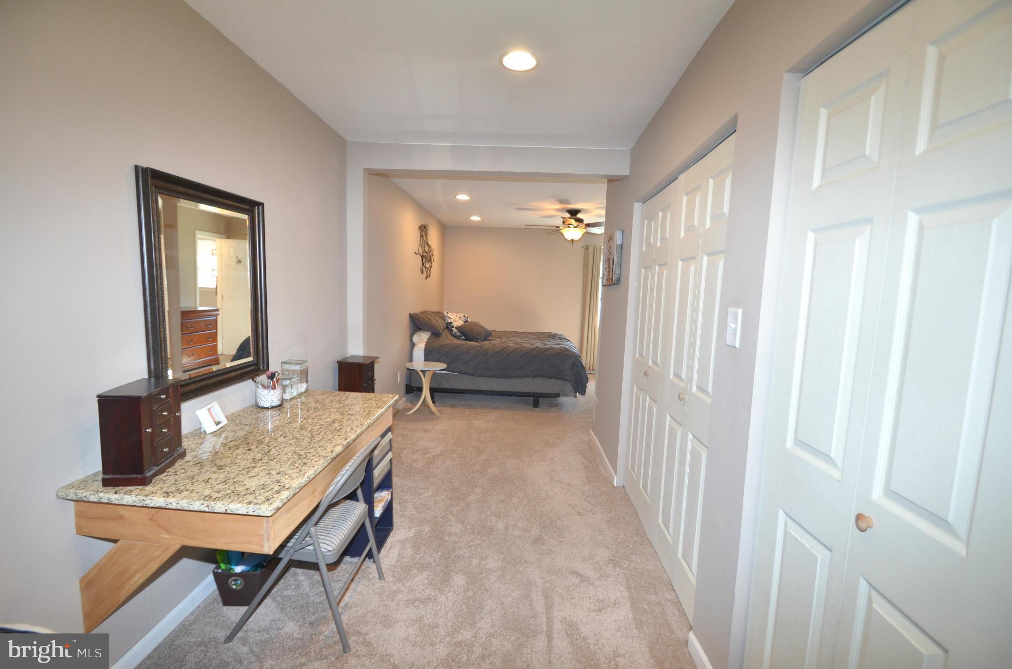 901 Beech Tree Road Severn, MD 21144 - Photo 11 of 27 a living room with furniture and a table