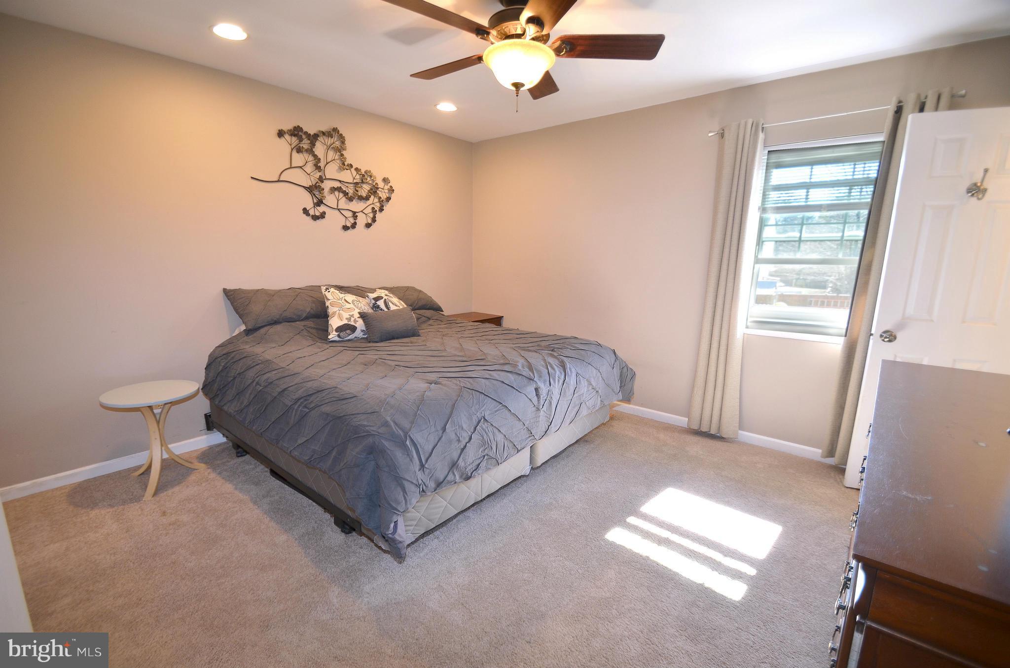 901 Beech Tree Road Severn, MD 21144 - Photo 12 of 27 a bedroom with a bed and a window