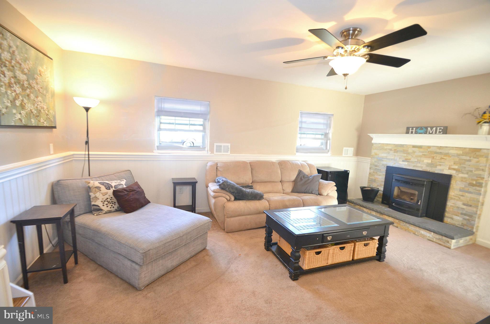 901 Beech Tree Road Severn, MD 21144 - Photo 18 of 27 a living room with furniture and a fireplace
