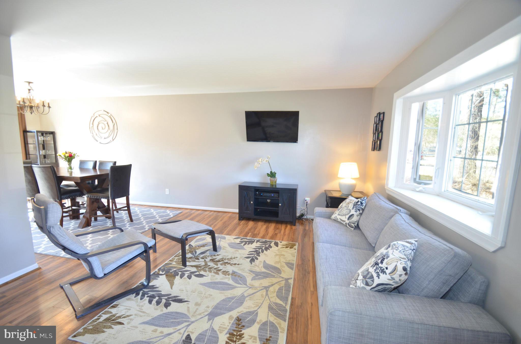 901 Beech Tree Road Severn, MD 21144 - Photo 3 of 27 a living room with furniture and wooden floor