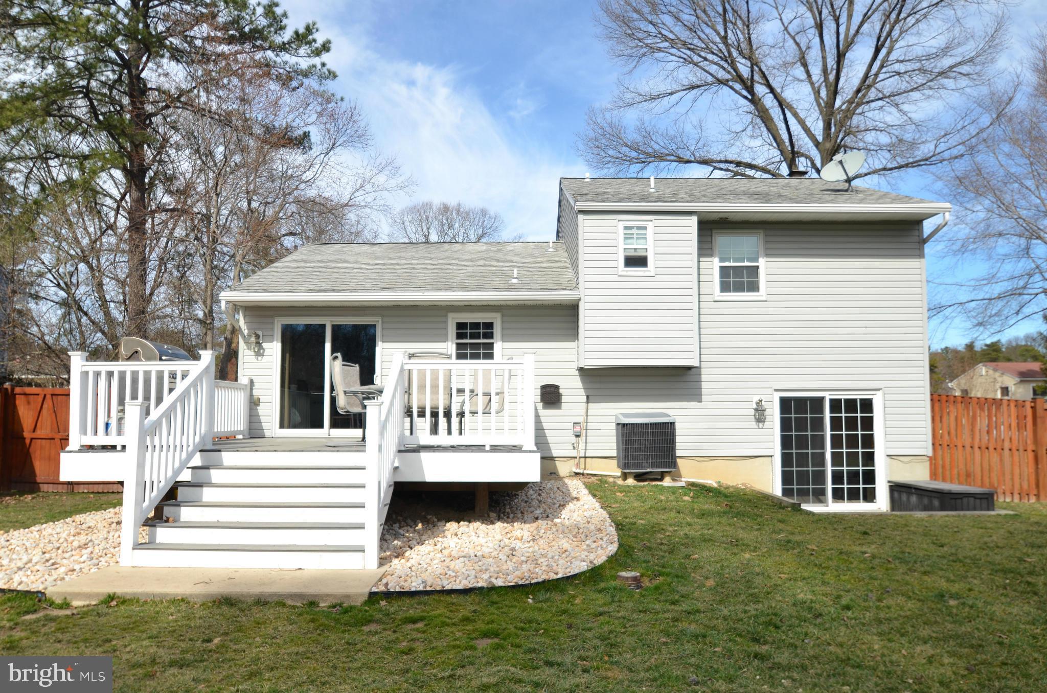 901 Beech Tree Road Severn, MD 21144 - Photo 25 of 27 a view of a house with a yard porch and fire pit