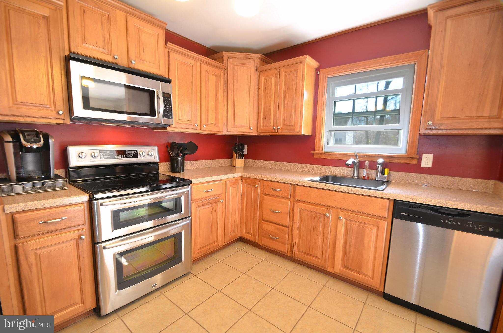 901 Beech Tree Road Severn, MD 21144 - Photo 8 of 27 a kitchen with cabinets appliances and a window