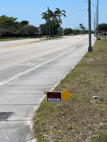 a backyard of a house with trees and lake view