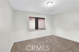20726 Nisqually Road Apple Valley, CA 92308 - Photo 12 of 16 an empty room with a window