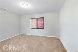 20726 Nisqually Road Apple Valley, CA 92308 - Photo 13 of 16 an empty room with a window
