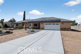 20726 Nisqually Road Apple Valley, CA 92308 - Photo 2 of 16 a view of a house with a patio