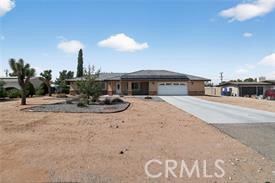 20726 Nisqually Road Apple Valley, CA 92308 - Photo 3 of 16 a view of a house with a swimming pool
