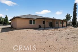 20726 Nisqually Road Apple Valley, CA 92308 - Photo 4 of 16 a view of a house with a yard