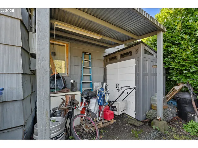 a view of a chairs and table in backyard of the house