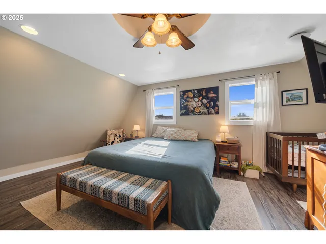a bedroom with a bed and a view of kitchen