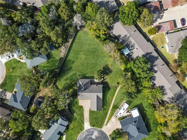 an aerial view of a house with outdoor space