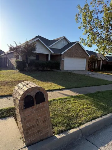 a view of backyard with a tub and trees