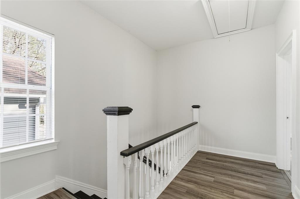 73 Atlanta Avenue Southwest Atlanta, GA 30315 - Photo 12 of 26 a view of a hallway with wooden floor and a window