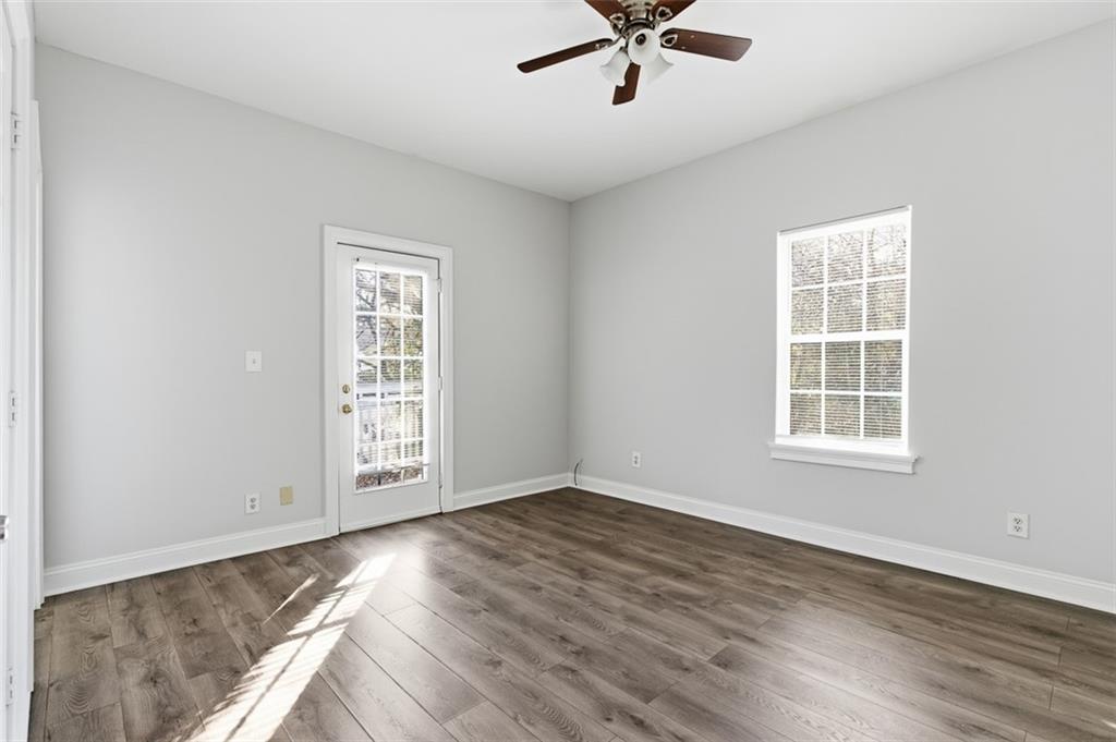 73 Atlanta Avenue Southwest Atlanta, GA 30315 - Photo 19 of 26 a view of an empty room with wooden floor and a window