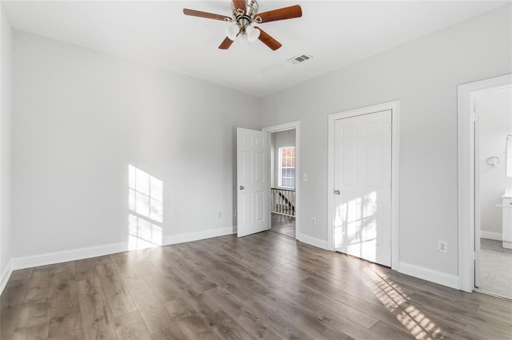 73 Atlanta Avenue Southwest Atlanta, GA 30315 - Photo 21 of 26 a view of empty room with wooden floor and fan
