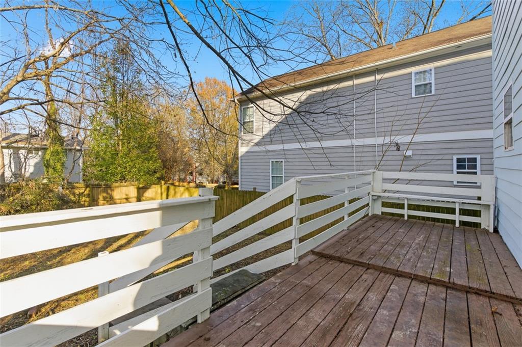73 Atlanta Avenue Southwest Atlanta, GA 30315 - Photo 23 of 26 a backyard of a house with wooden floor and outdoor seating