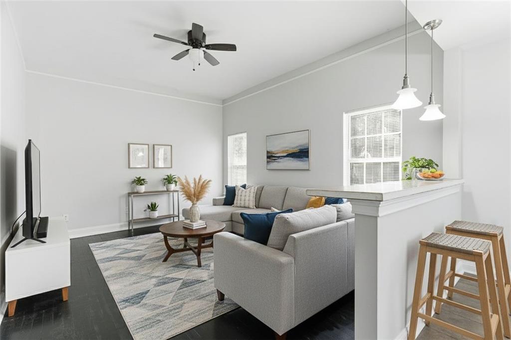 73 Atlanta Avenue Southwest Atlanta, GA 30315 - Photo 4 of 26 a living room with furniture a flat screen tv and a window