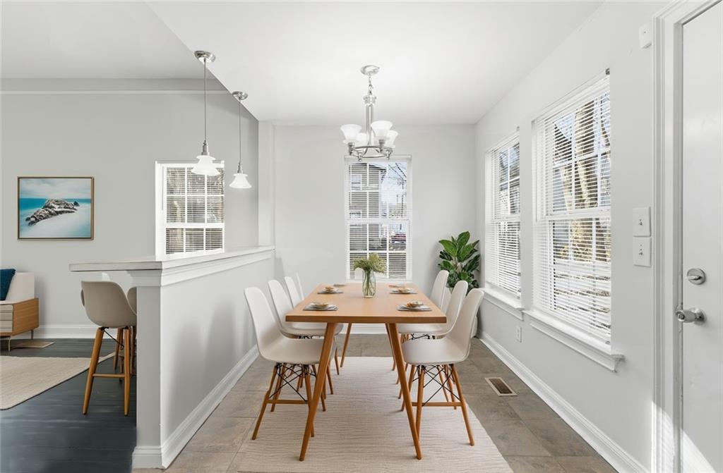 73 Atlanta Avenue Southwest Atlanta, GA 30315 - Photo 7 of 26 a view of a dining room with furniture window and outside view