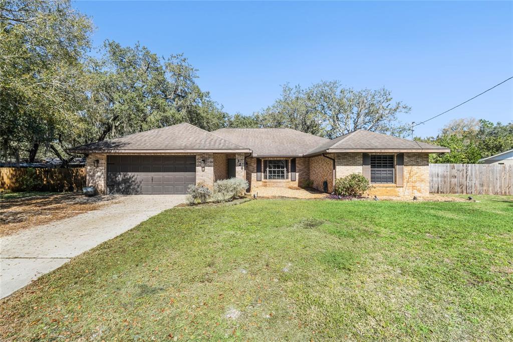 328 Colomba Road DeBary, FL 32713 - Photo 1 of 1 a front view of a house with yard porch and furniture