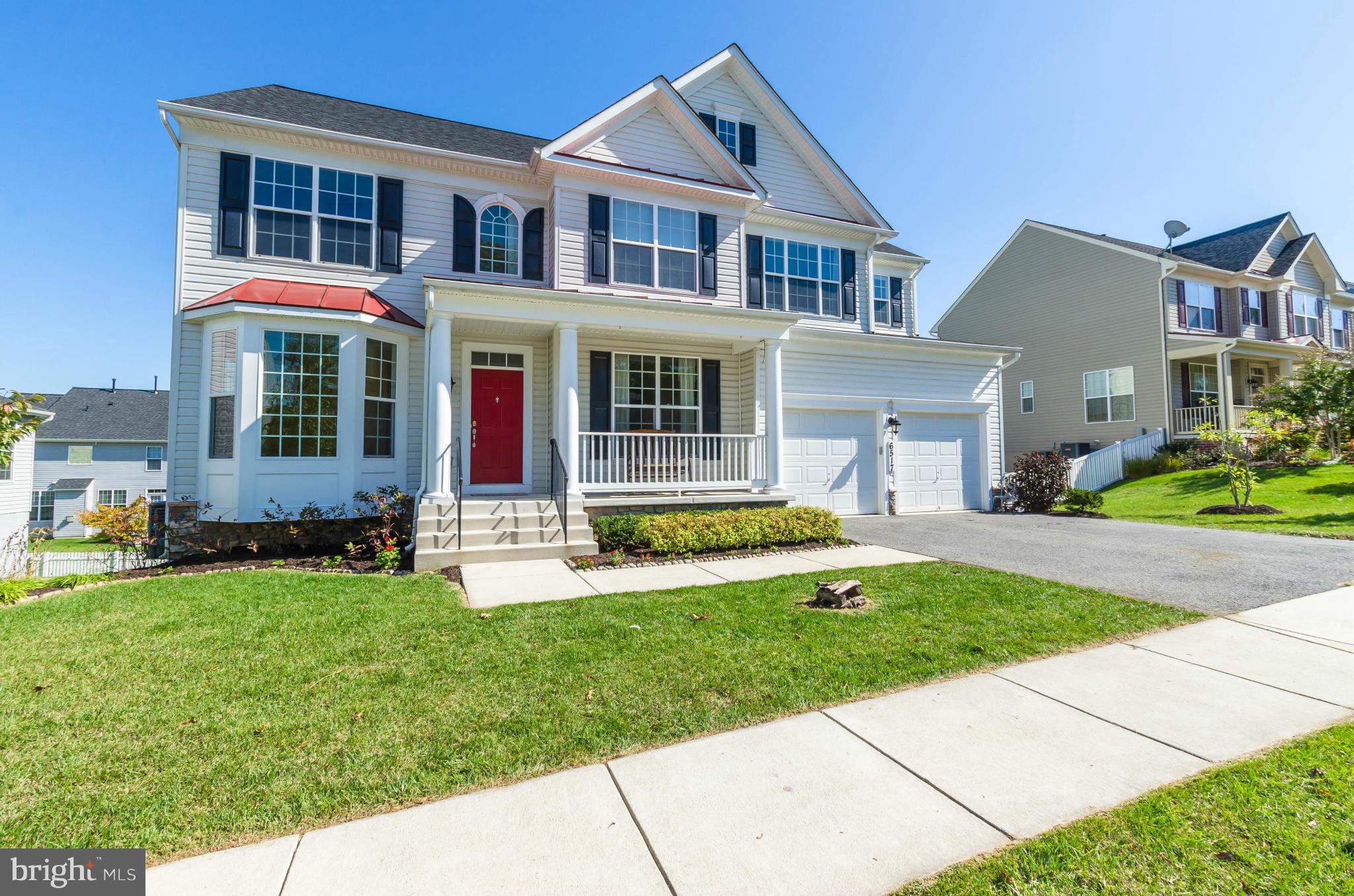 6517 Clarington Road Baltimore, MD 21209 - Photo 1 of 30 a front view of house with yard and green space