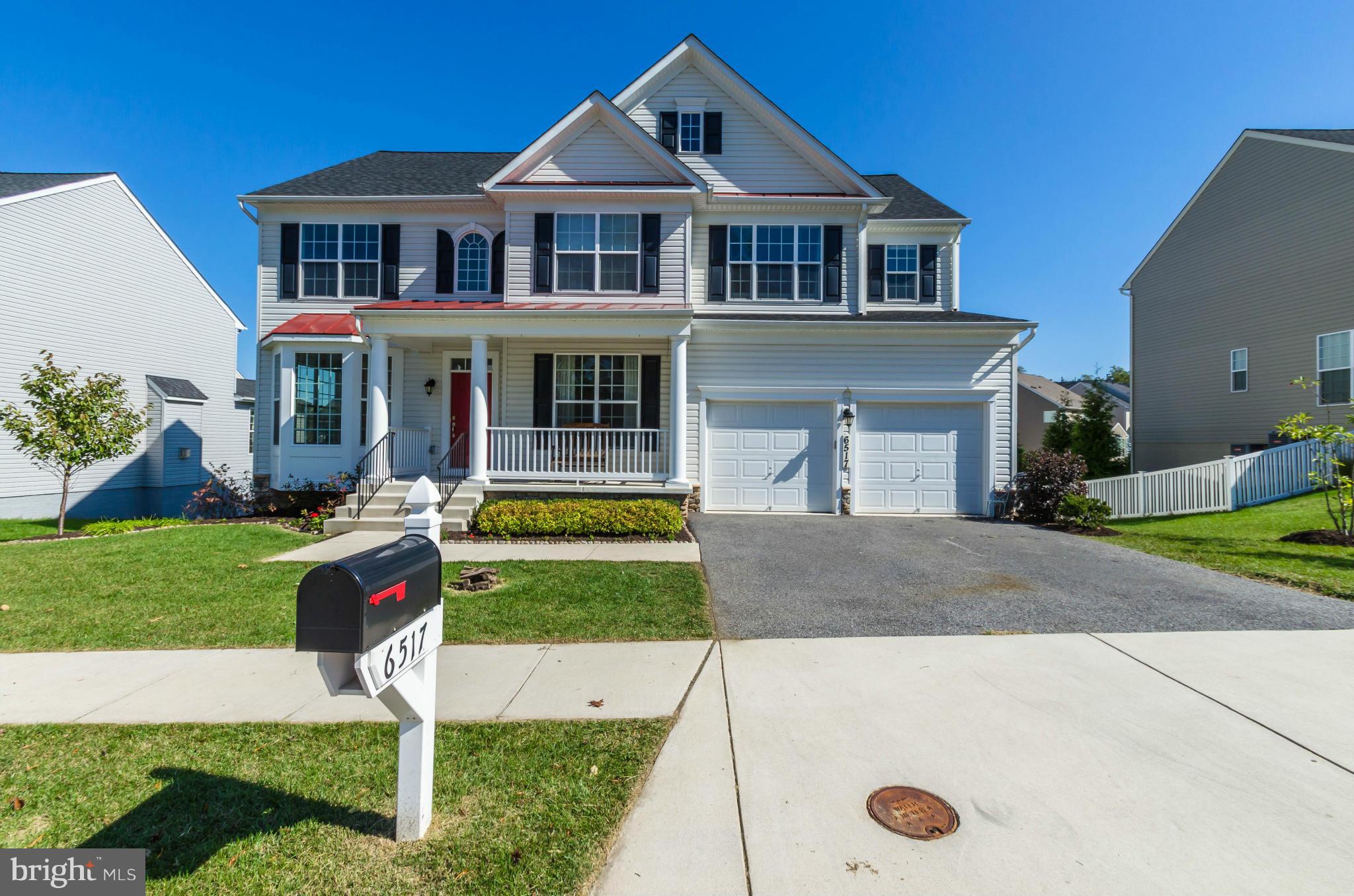 6517 Clarington Road Baltimore, MD 21209 - Photo 2 of 30 a front view of house with yard and green space