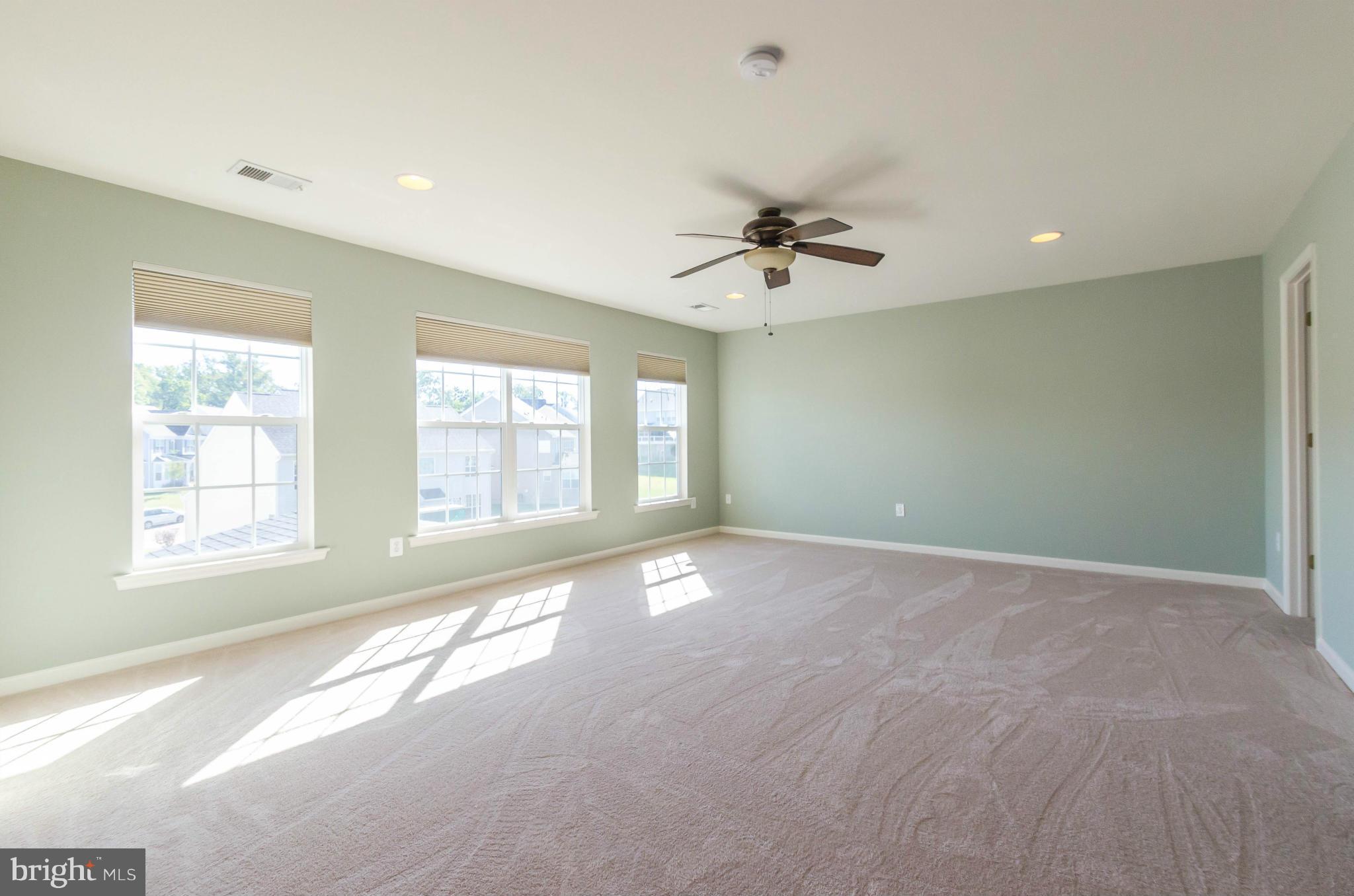 6517 Clarington Road Baltimore, MD 21209 - Photo 13 of 30 a view of an empty room with a window