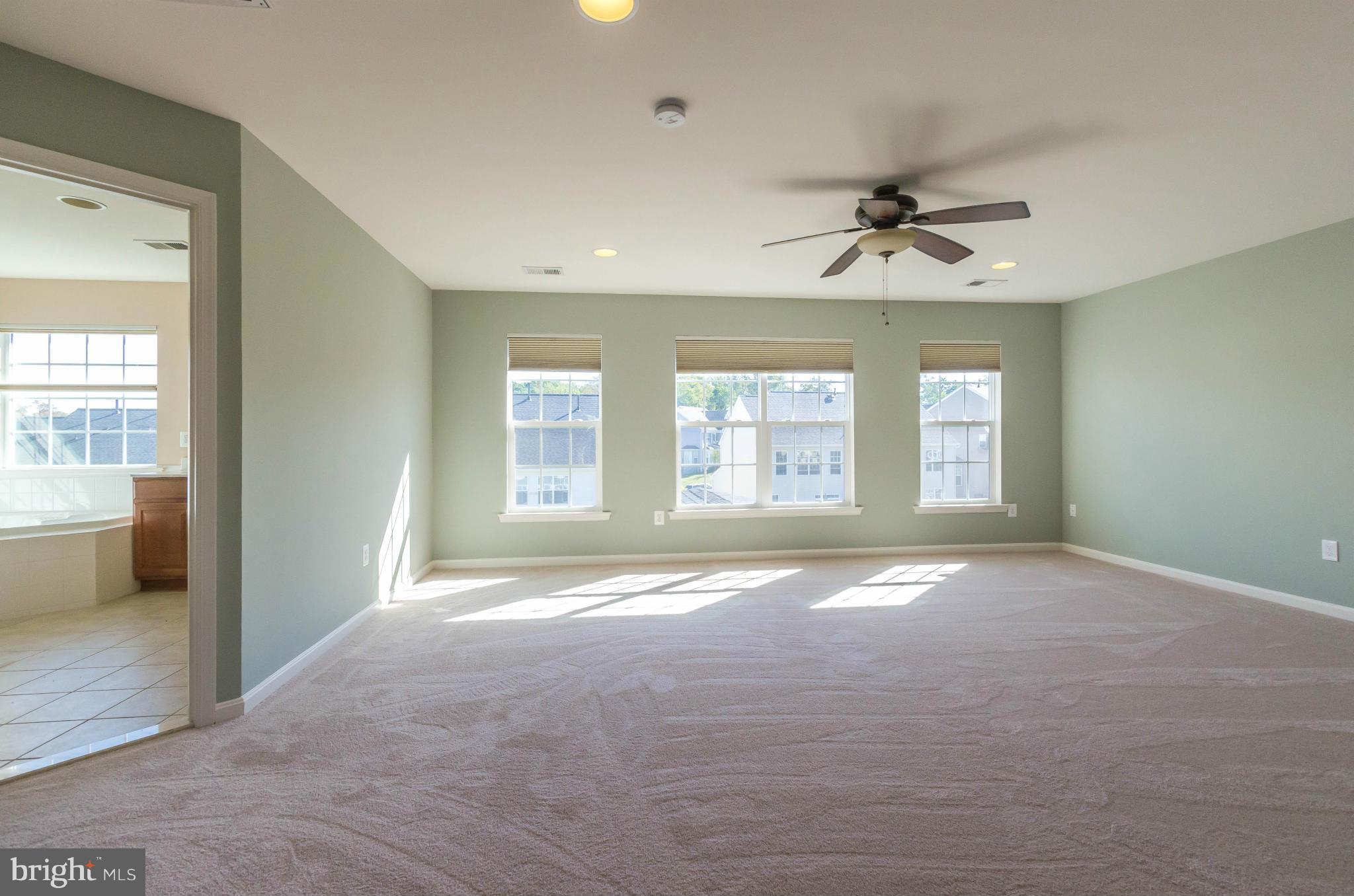 6517 Clarington Road Baltimore, MD 21209 - Photo 14 of 30 a view of an empty room with a window