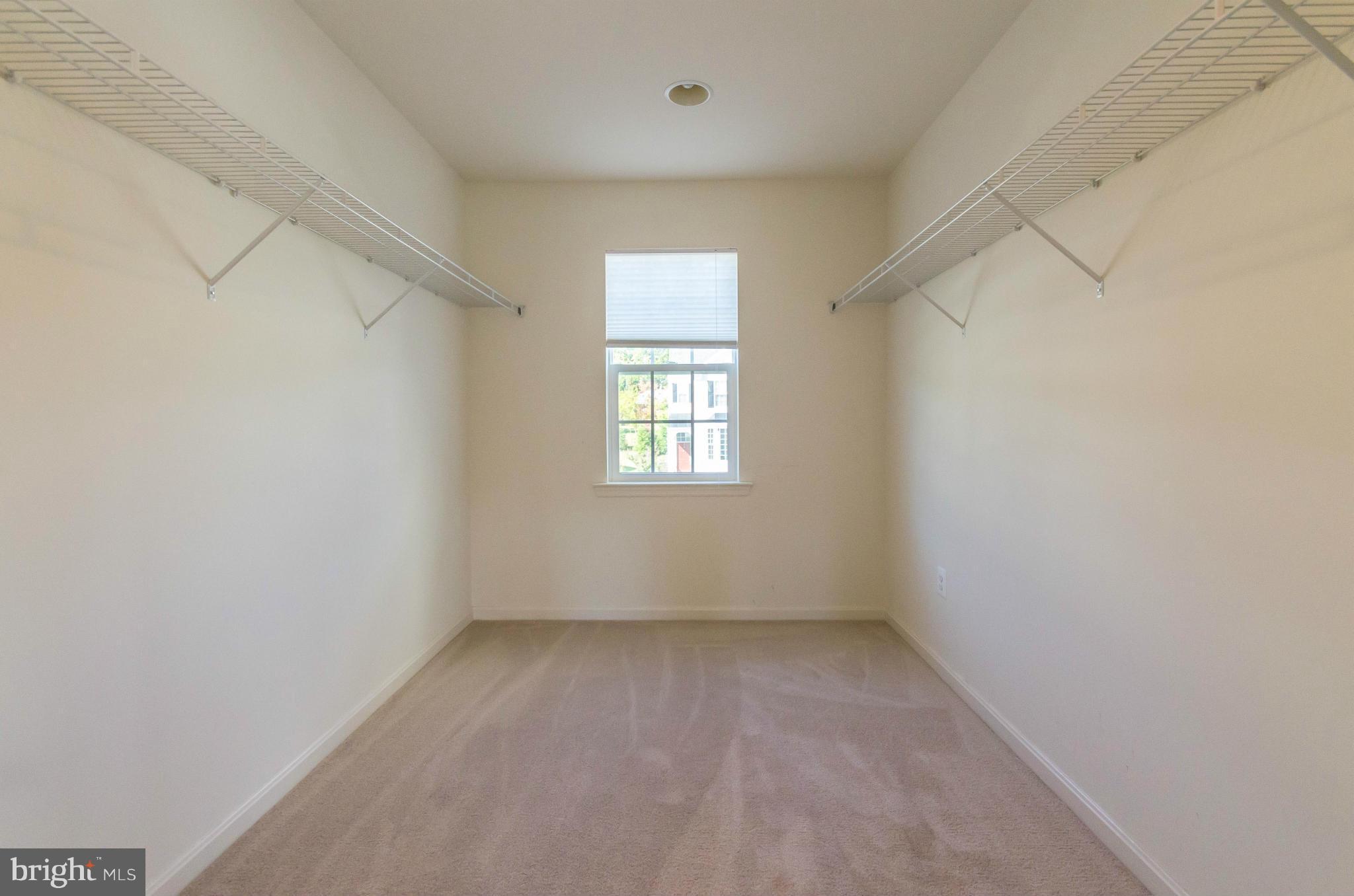 6517 Clarington Road Baltimore, MD 21209 - Photo 16 of 30 an empty room with a window