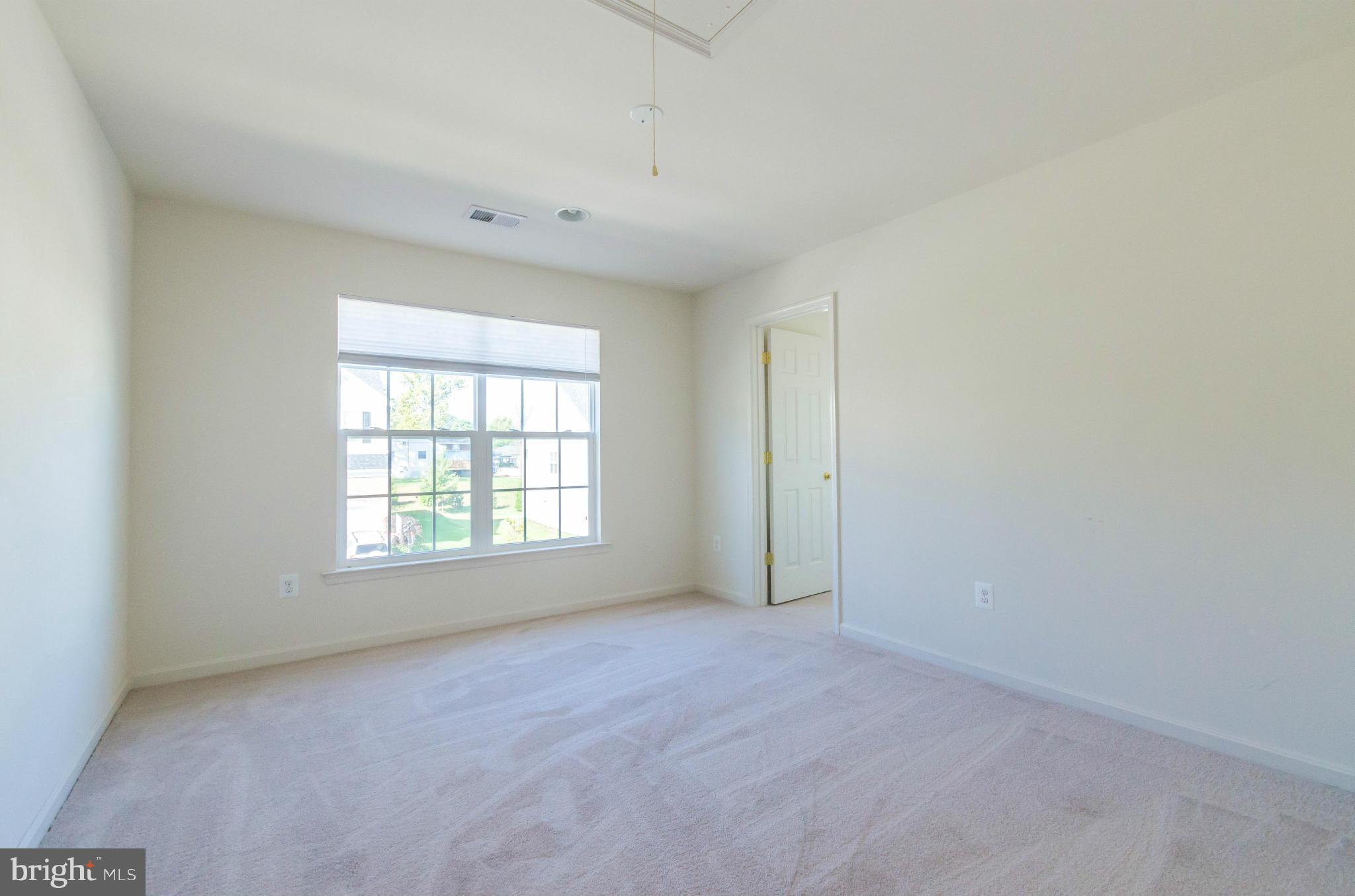 6517 Clarington Road Baltimore, MD 21209 - Photo 18 of 30 an empty room with a window