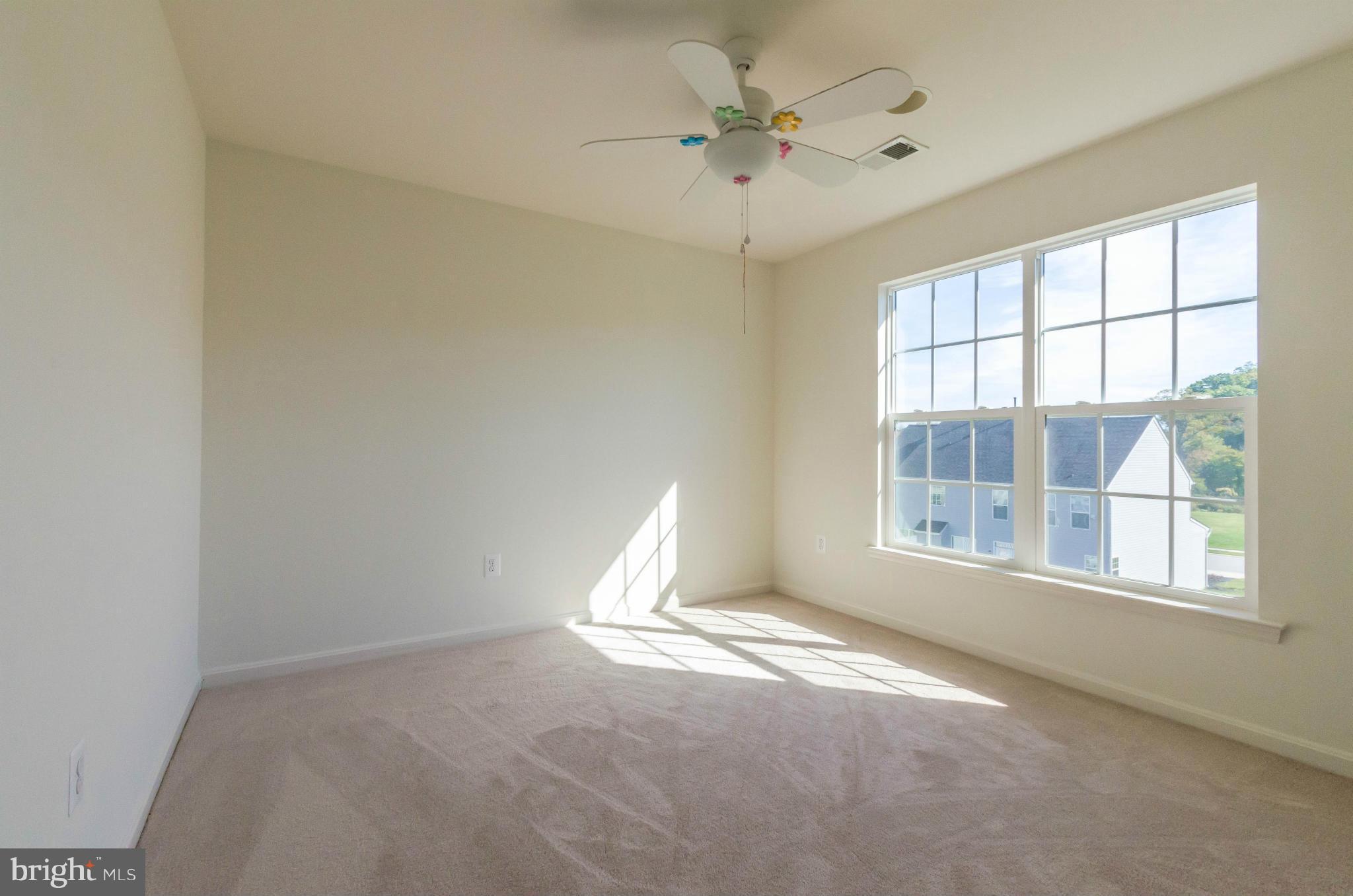 6517 Clarington Road Baltimore, MD 21209 - Photo 20 of 30 an empty room with a empty space and windows