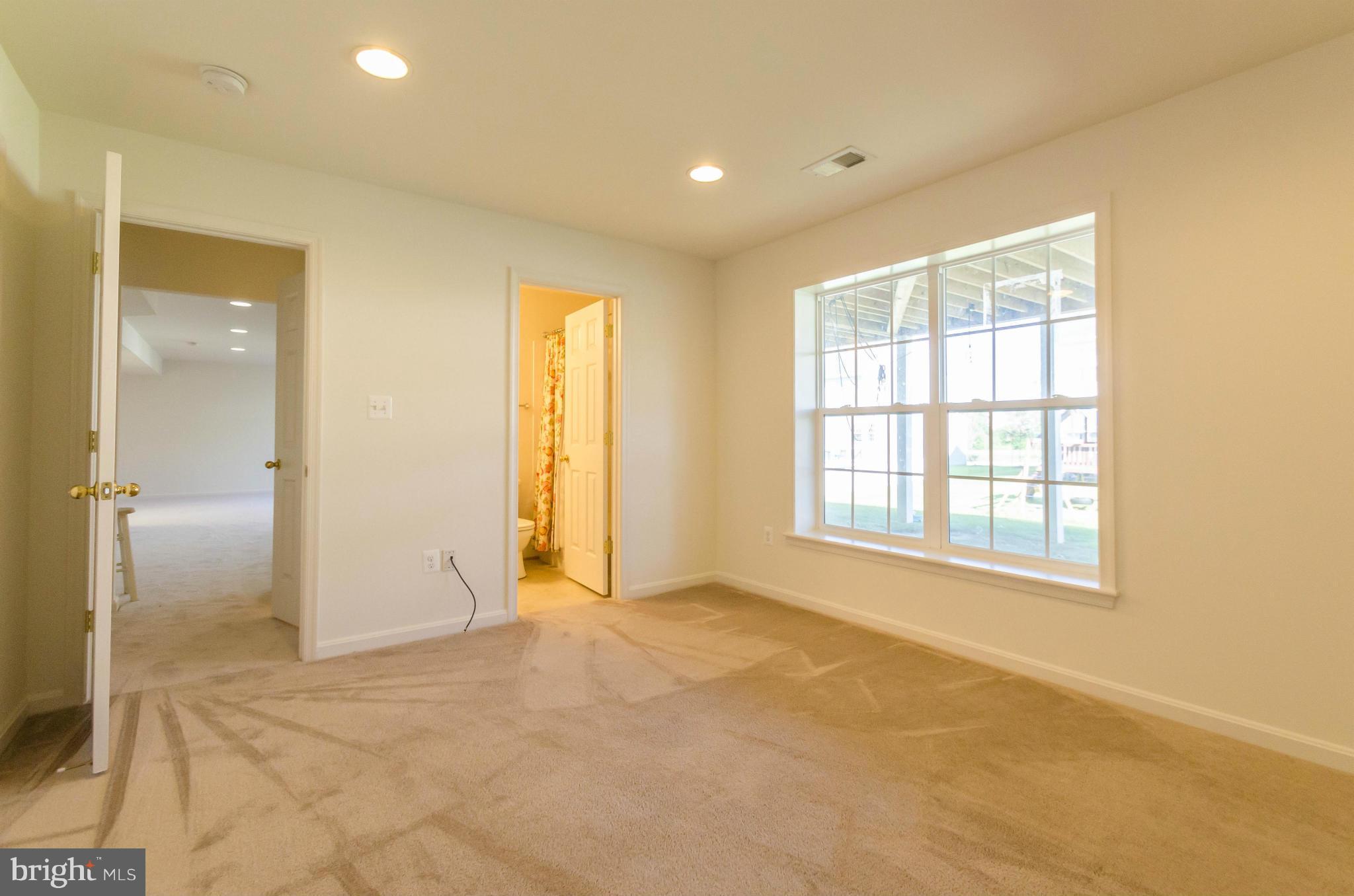 6517 Clarington Road Baltimore, MD 21209 - Photo 22 of 30 a view of an empty room with a window