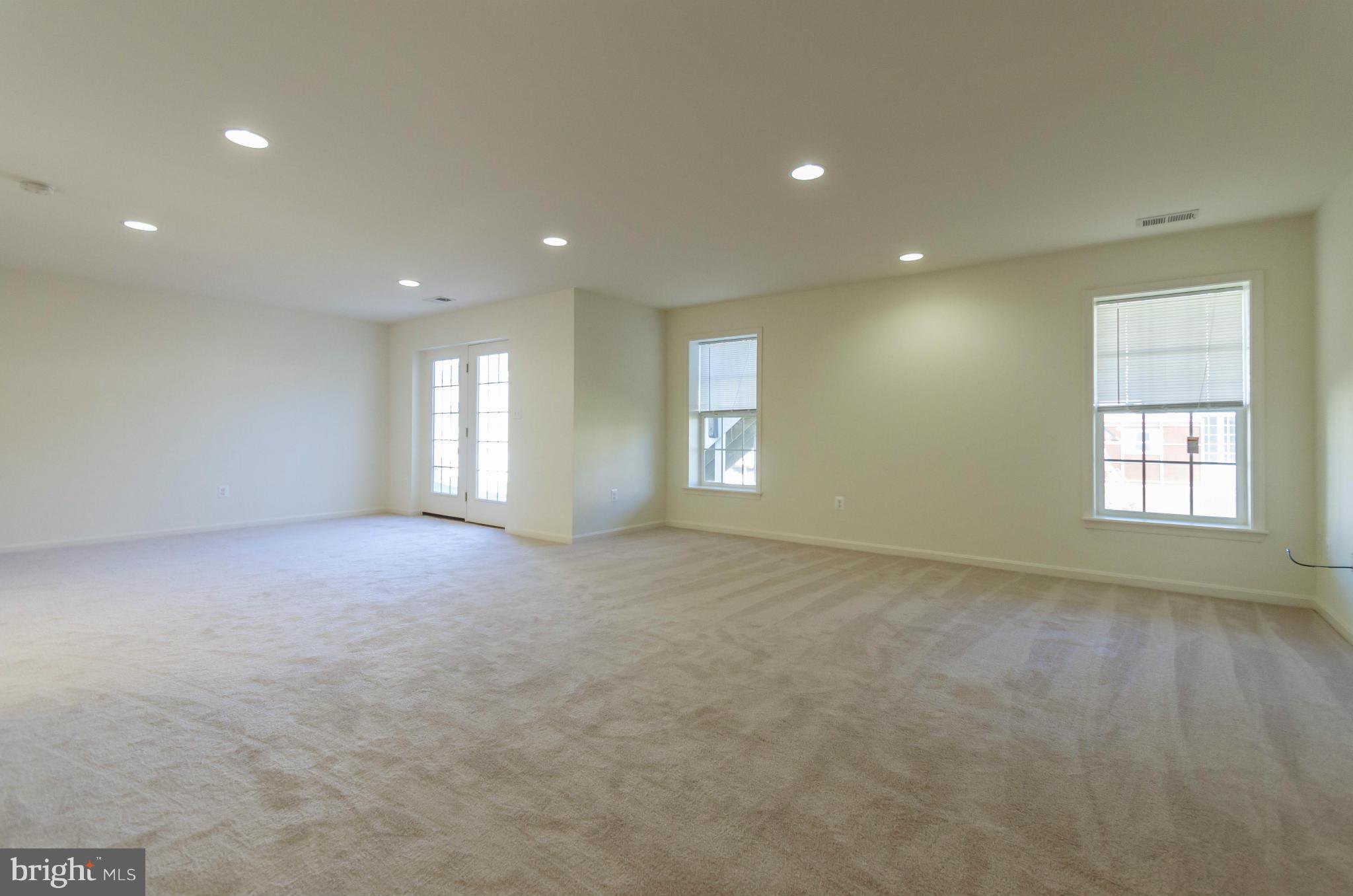 6517 Clarington Road Baltimore, MD 21209 - Photo 24 of 30 an empty room with windows and closet