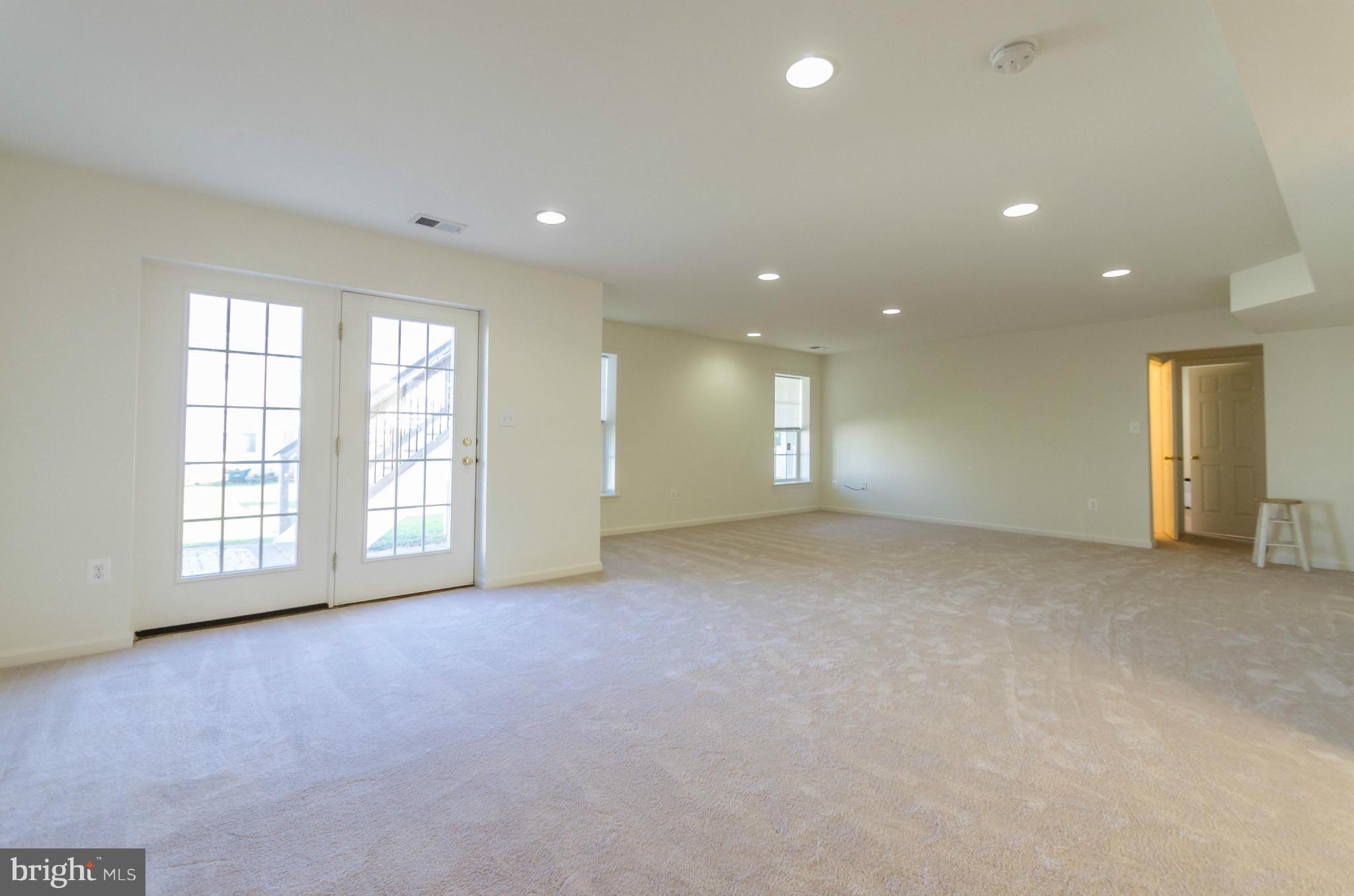 6517 Clarington Road Baltimore, MD 21209 - Photo 25 of 30 a view of an empty room with a window
