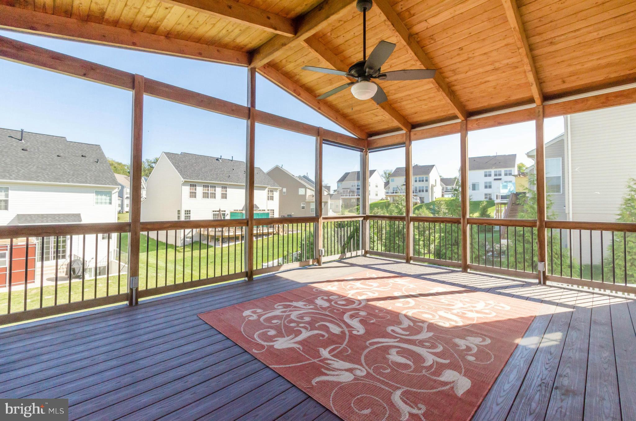 6517 Clarington Road Baltimore, MD 21209 - Photo 30 of 30 a view of porch with a floor to ceiling window next to a yard