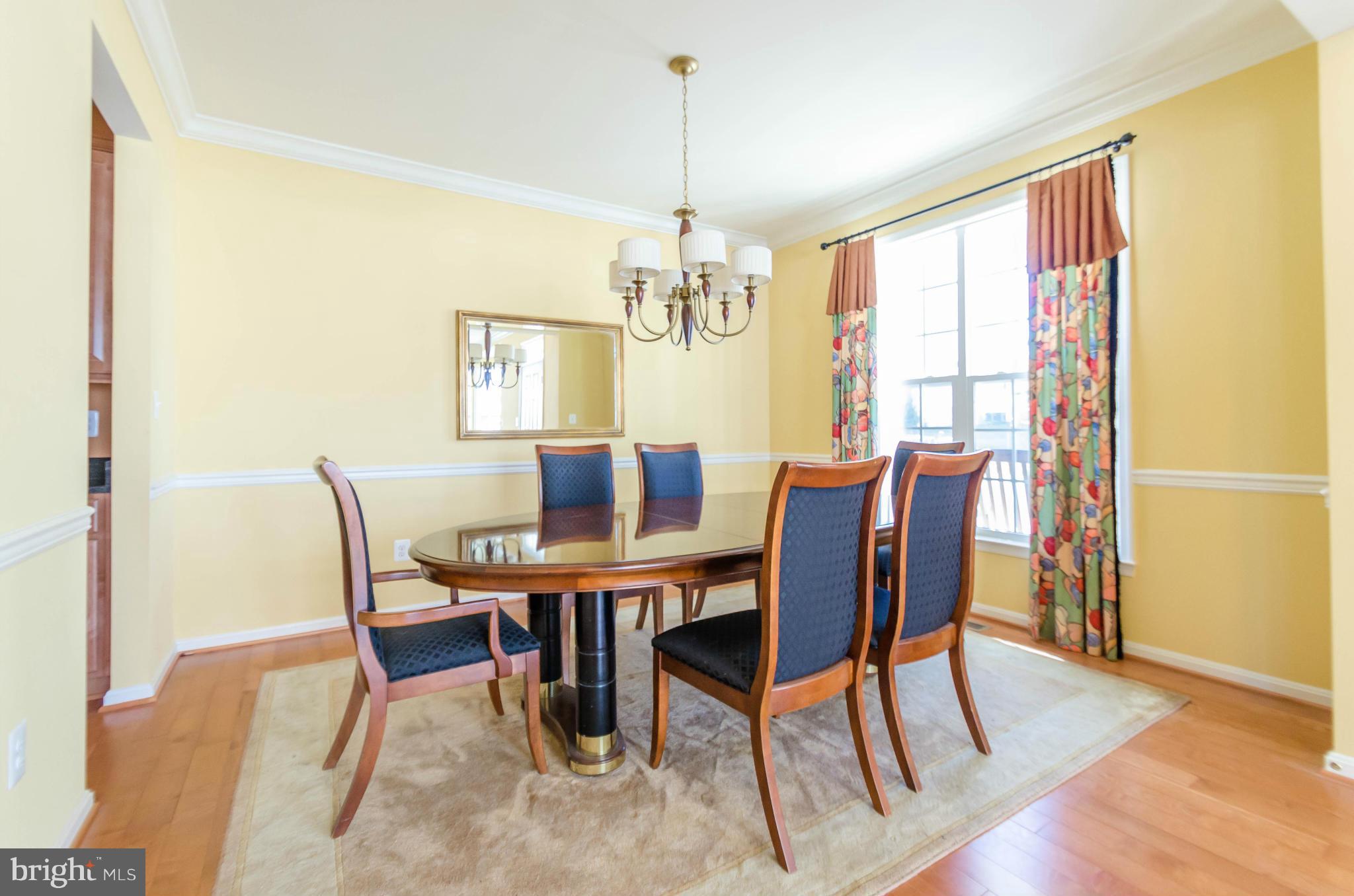 6517 Clarington Road Baltimore, MD 21209 - Photo 5 of 30 a view of a dining room with furniture window and wooden floor