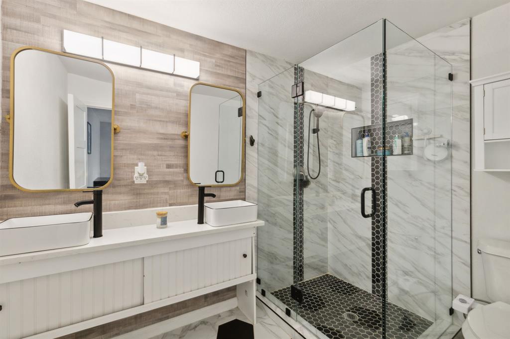 2630 Springvale Drive Farmers Branch, TX 75234 - Photo 14 of 25 a bathroom with a shower and a sink