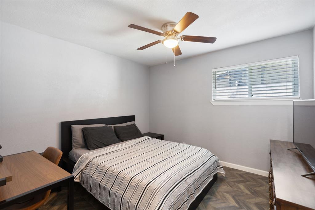 2630 Springvale Drive Farmers Branch, TX 75234 - Photo 15 of 25 a bedroom with a bed and a window