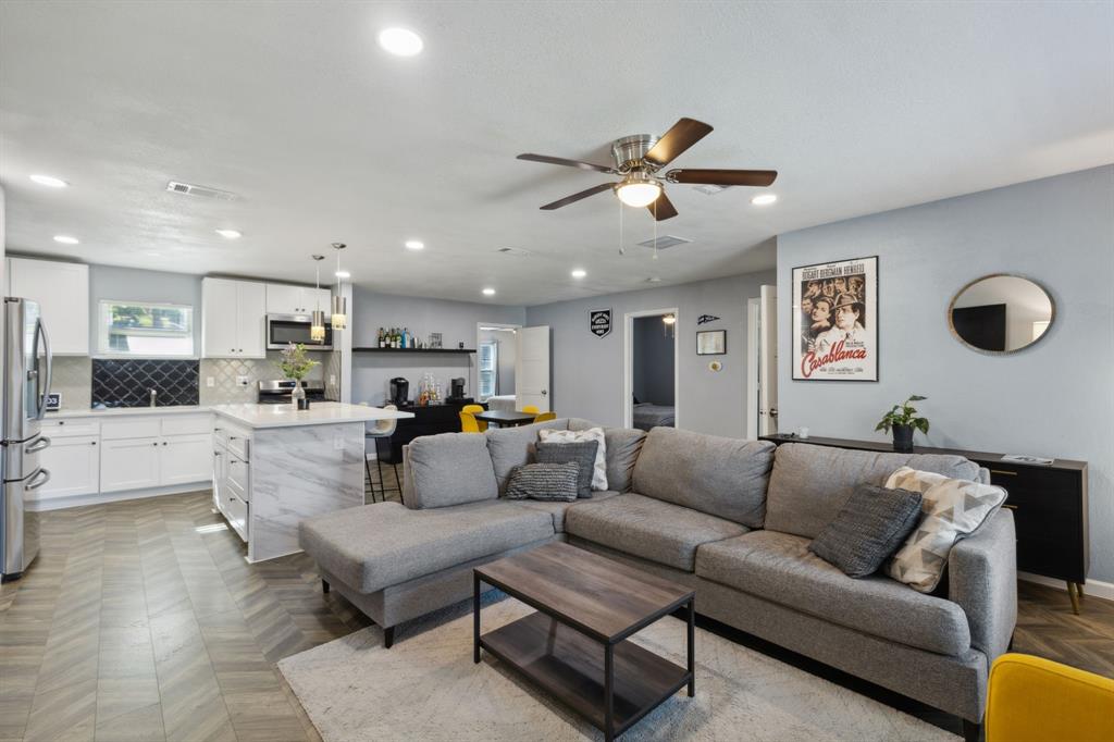 2630 Springvale Drive Farmers Branch, TX 75234 - Photo 2 of 25 a living room with furniture kitchen view and a window