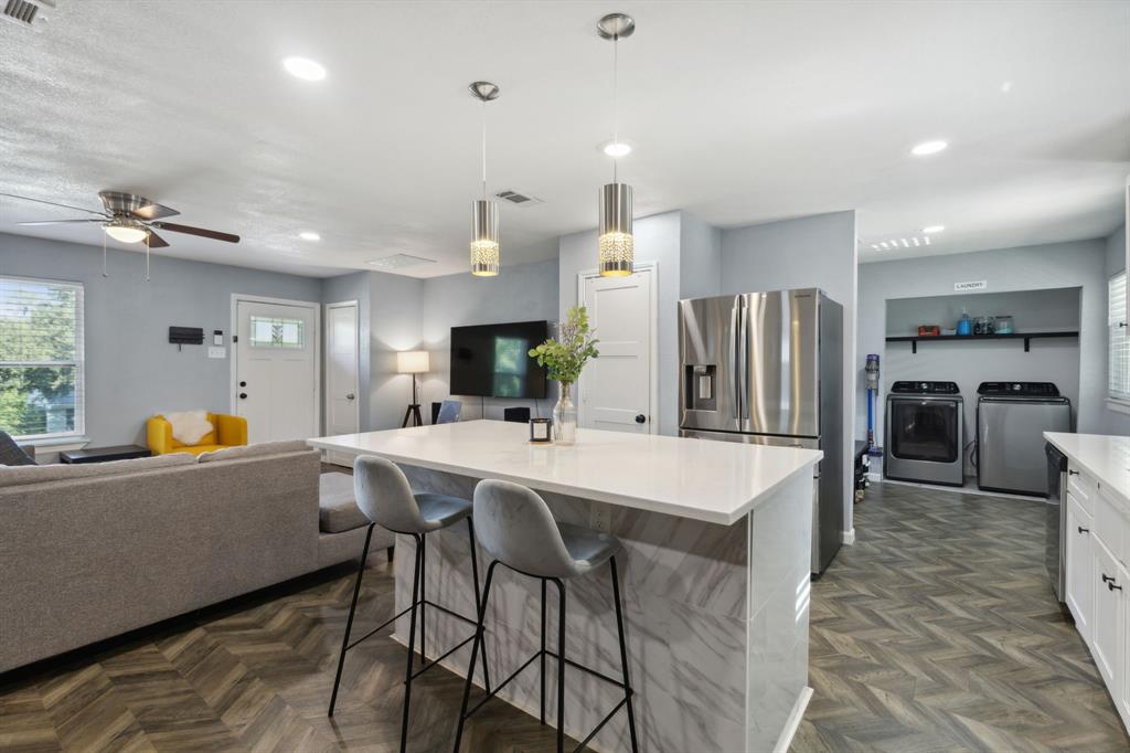 2630 Springvale Drive Farmers Branch, TX 75234 - Photo 6 of 25 a large kitchen with a table and chairs