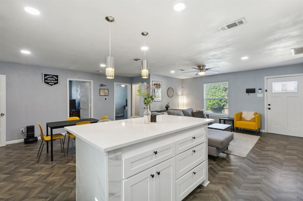 2630 Springvale Drive Farmers Branch, TX 75234 - Photo 7 of 25 a large kitchen with a table and chairs