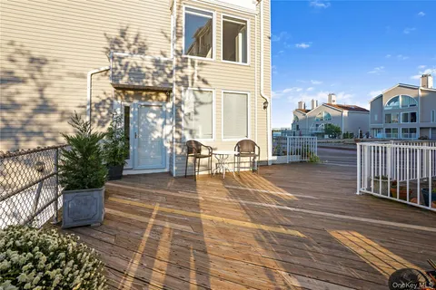 a view of a patio with couches and potted plants