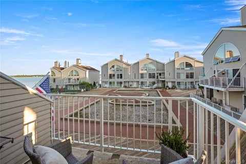 a view of a brick house with many windows